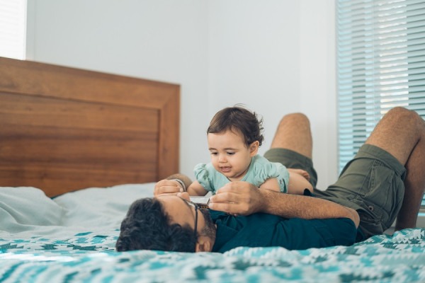 Dad playing with baby