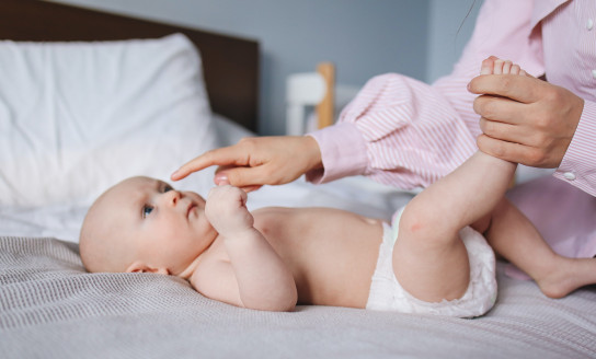 crop mother playing with baby 3875083