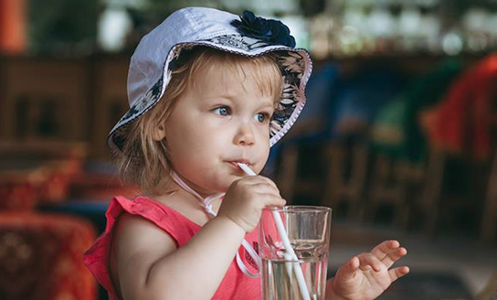 heat and dehydration child drinking water