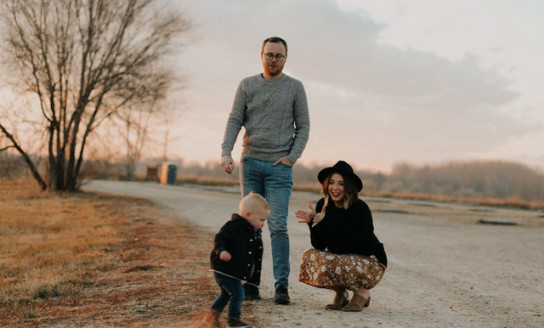 photo of baby walking near his parents 3767514